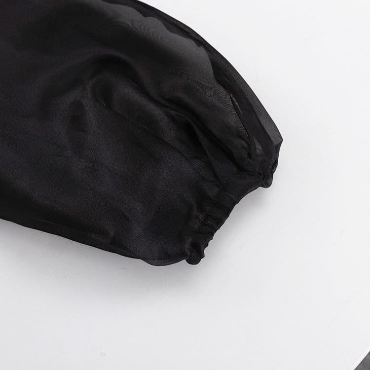 Elegant noir kimono by Serena Ken, featuring flowing sleeves and a classic silhouette on a neutral background.