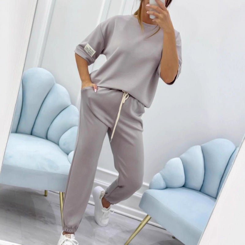 Serena Ken Lilas clothes featuring a stylish, colorful design displayed on a hanger.