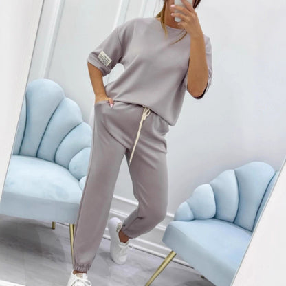 Serena Ken Lilas clothes featuring a stylish, colorful design displayed on a hanger.