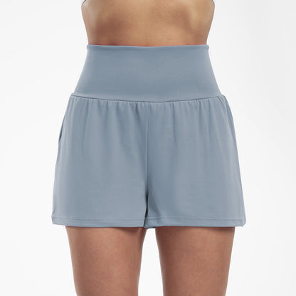 Serena Ken Sport Flow athletic clothes showing a sleek, fitted sports top and leggings designed for active wear.