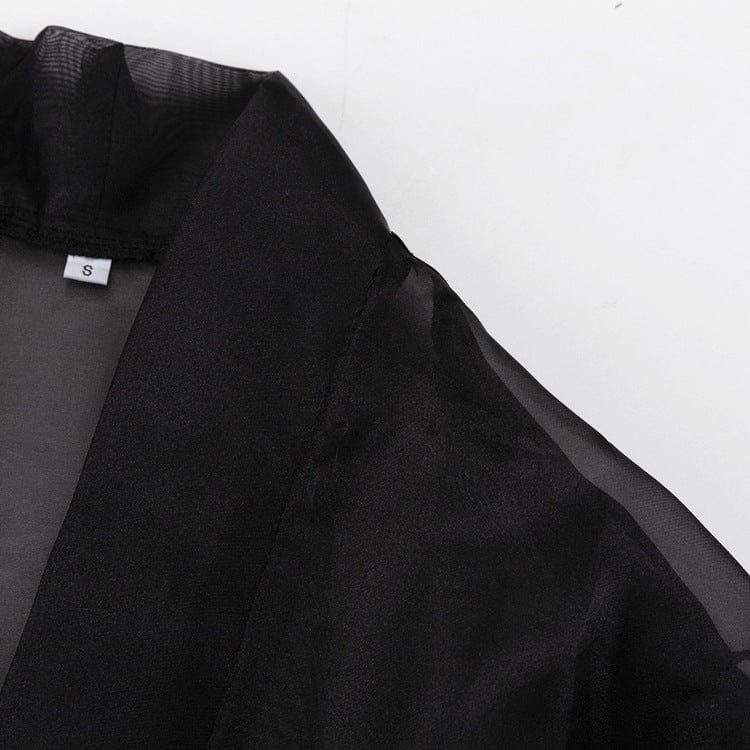 Elegant Noir Kimono by Serena Ken featuring flowing fabric and a stylish design, perfect for layering over outfits.