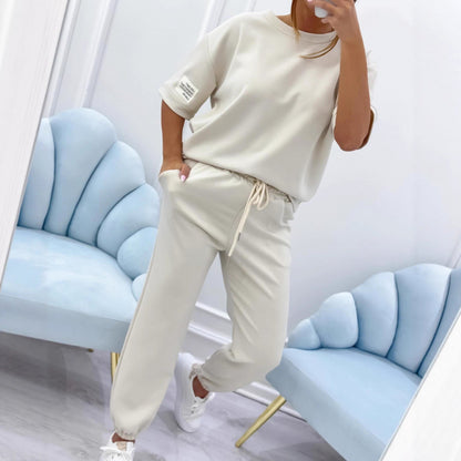 Serena Ken Lilas clothes featuring soft fabric and stylish design, displayed on a hanger against a neutral background.