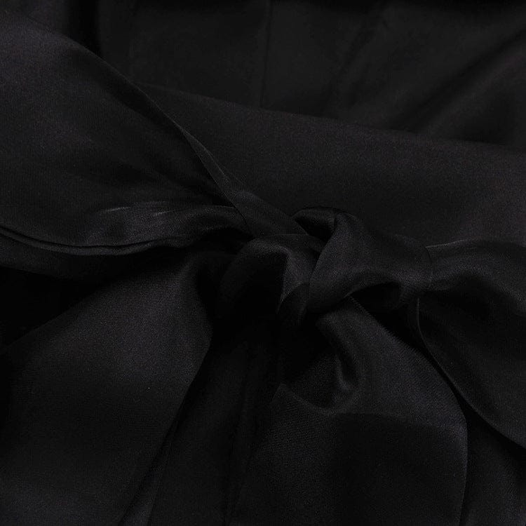 Elegant Noir Kimono by Serena Ken, showcasing a flowing black design with intricate patterns and a relaxed fit.