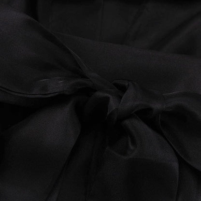 Elegant Noir Kimono by Serena Ken, showcasing a flowing black design with intricate patterns and a relaxed fit.